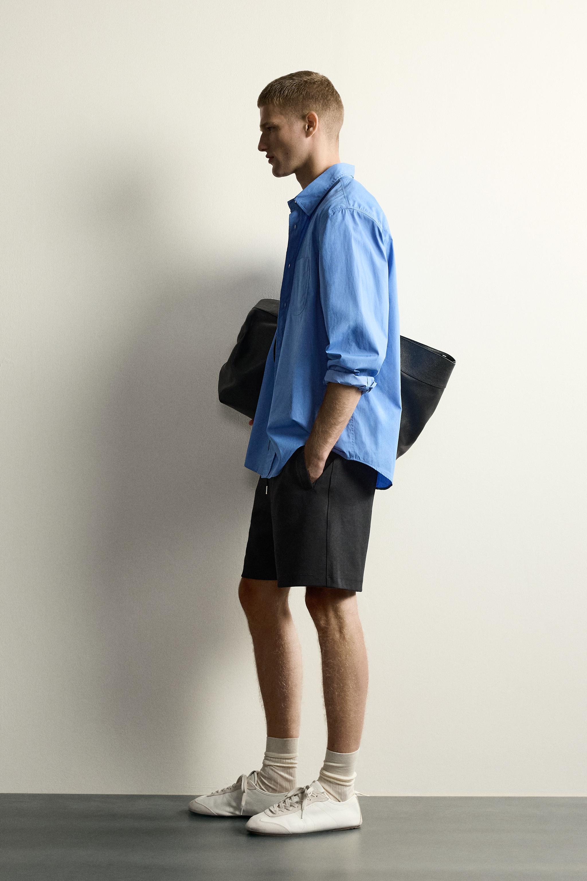 RELAXED FIT INTERLOCK TRACK SHORTS